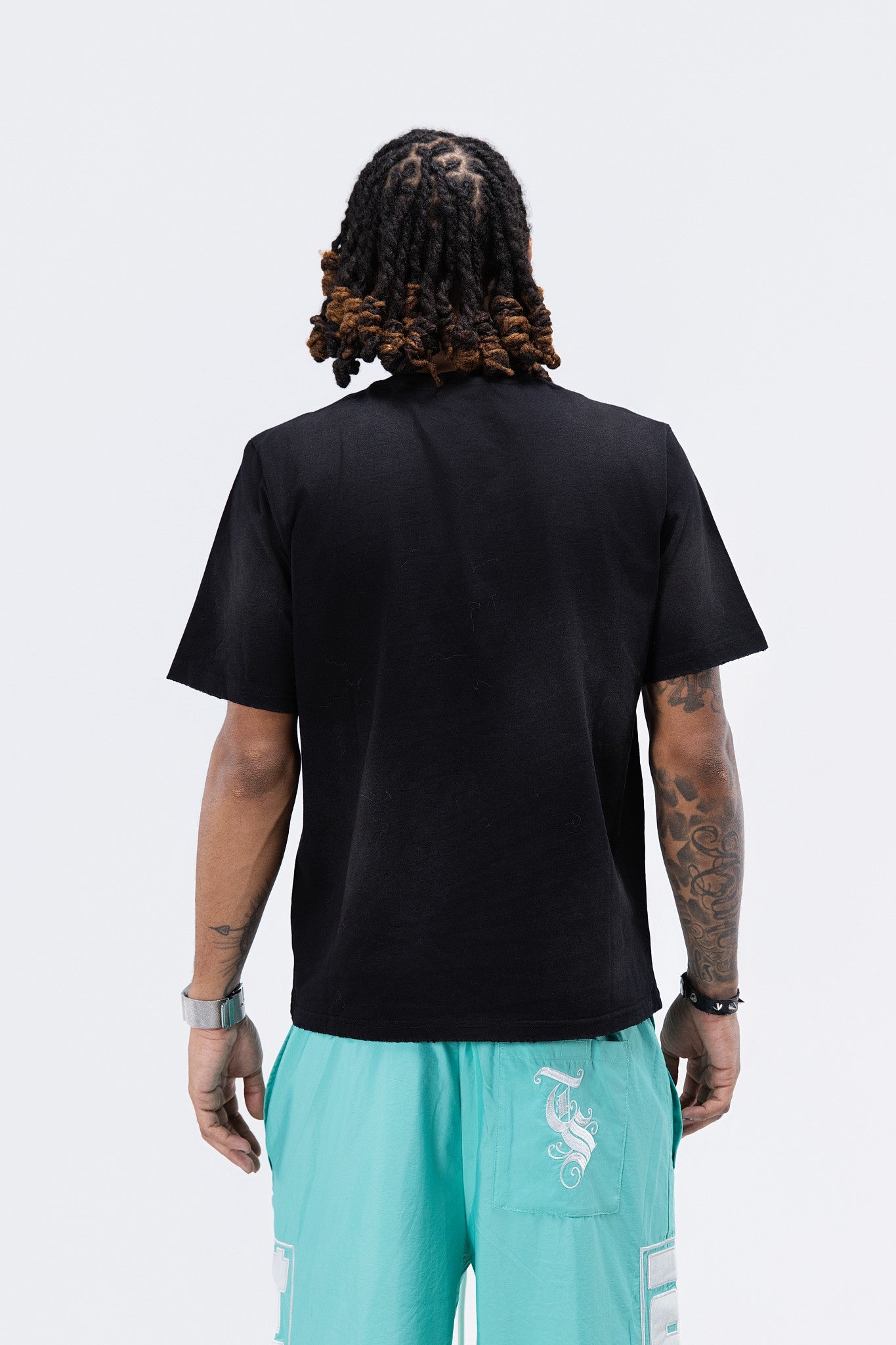 Many Faces Black Tee